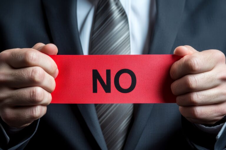 Person holding red No sign