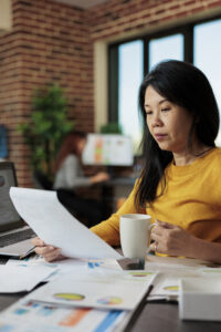 Asian compliance manager reviewing customer due diligence strategy and APTCP obligations for Japanese financial institutions