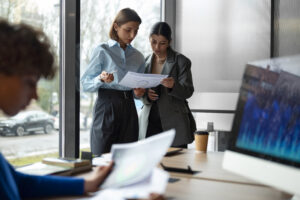 Financial compliance team analyzing cross-border transaction data for Foreign Exchange Act screening obligations in Japan