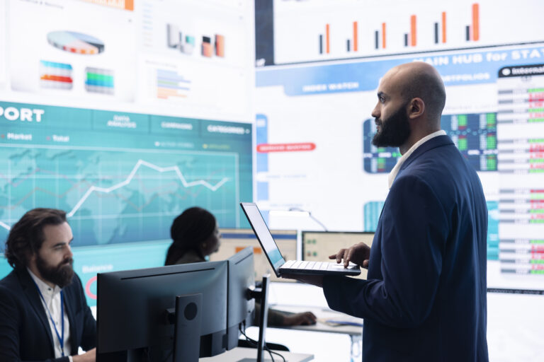 Compliance team assembling in a data room to review transaction monitoring system performance and AML detection data for Japanese institutions