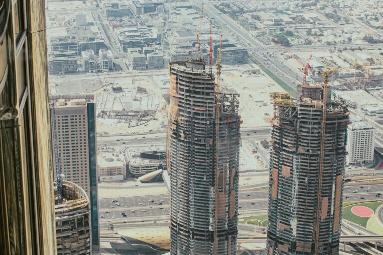 Modern GCC business district representing AML obligations across DIFC, ADGM, JAFZA, DMCC and other free zones