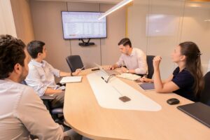 Executive boardroom representing politically exposed person risk management in GCC compliance programmes
