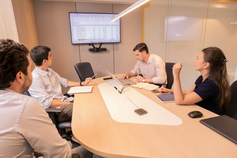 Executive boardroom representing politically exposed person risk management in GCC compliance programmes