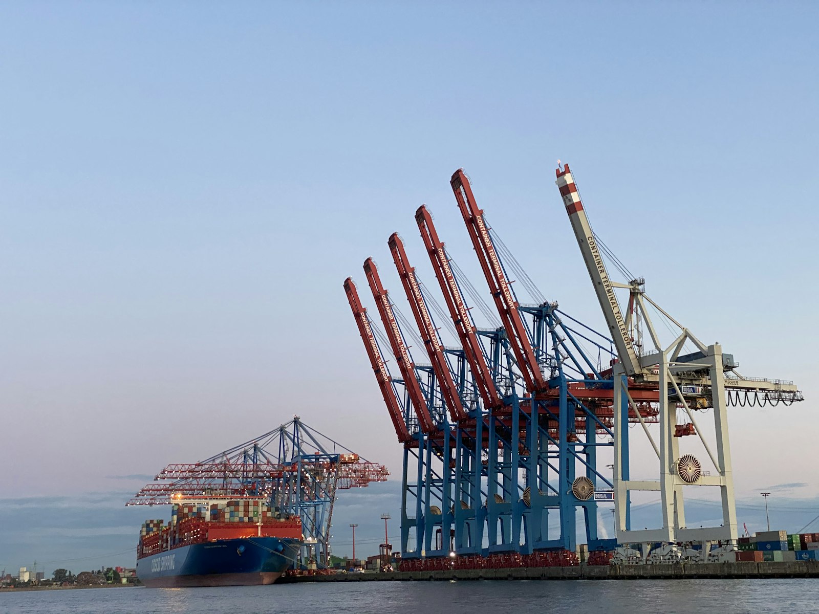 Container port with cargo cranes representing trade-based money laundering risks in Gulf trade corridors