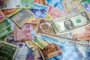 International banknotes representing hawala and alternative remittance AML compliance in the GCC region