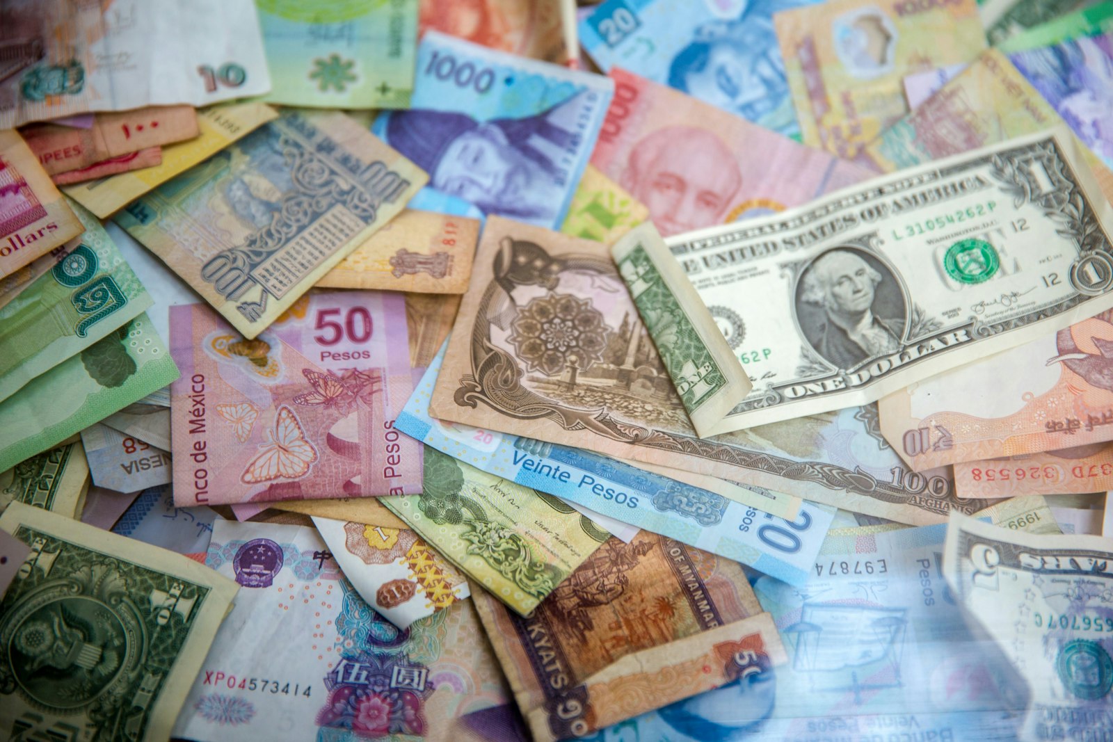 International banknotes representing hawala and alternative remittance AML compliance in the GCC region