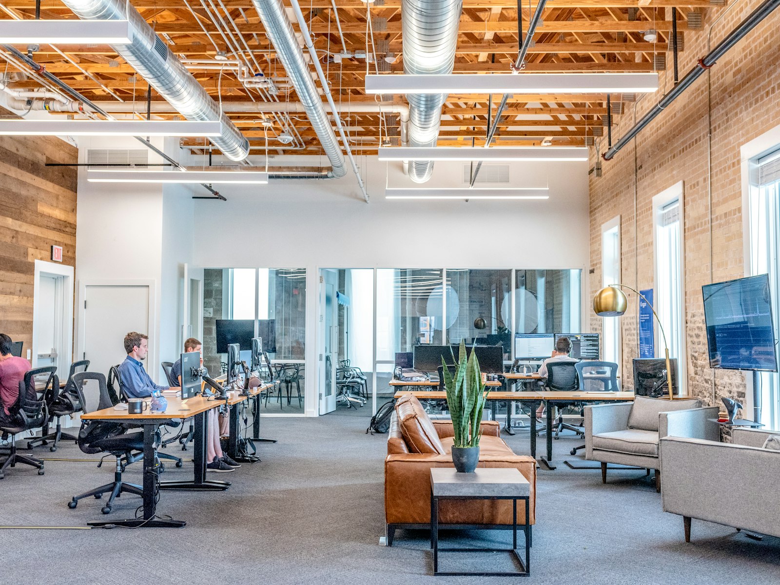 Compliance professionals reviewing PEP screening matches and due diligence documentation in a modern office