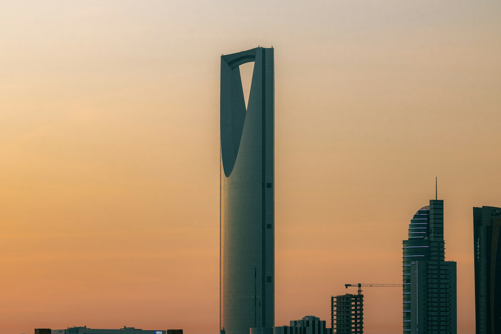 Riyadh skyline dominated by the Kingdom Centre tower at dusk, representing the regulatory environment for SAMA AML/CFT compliance in Saudi Arabia