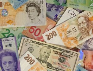 International banknotes in multiple currencies representing hawala remittance and exchange house compliance in the UAE