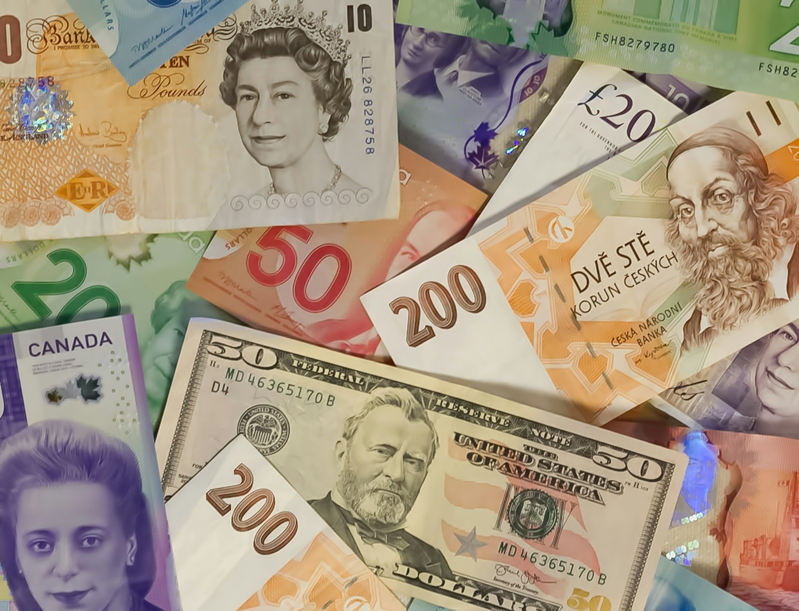 International banknotes in multiple currencies representing hawala remittance and exchange house compliance in the UAE